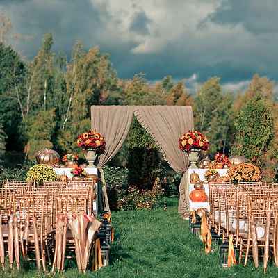 Outdoor autumn wedding ceremony decor