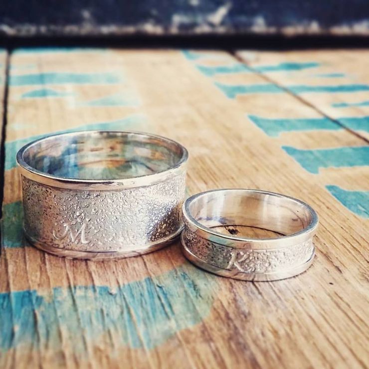 Custom Bands Embossed with Sand from the couple's own special beach.