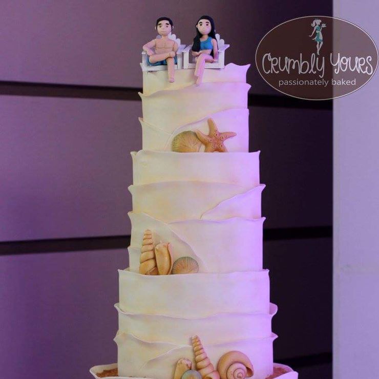 JC and Riz' Beach themed Wedding Cake with handmade fondant seashells and the Bride and Groom topper